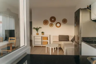 Una televisión o centro de entretenimiento en El Libre - Ocean View Apartment