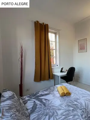 Cama o camas de una habitación en CoLiving Villa Brasil