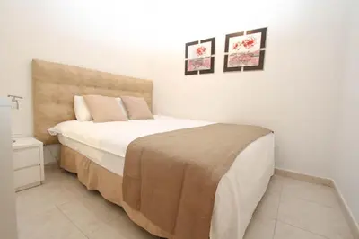 Cama o camas de una habitación en Casa grande familiar con 4 terrazas