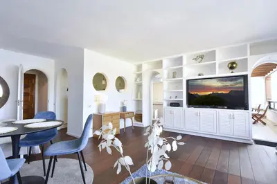 Una televisión o centro de entretenimiento en Doñana 1213 &1214, lux penthouse