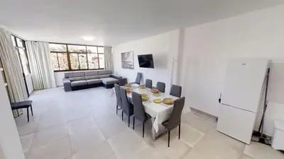 Zona de estar de VV Las Buganvillas MASPALOMAS - Cocina y habitaciones con baños privados