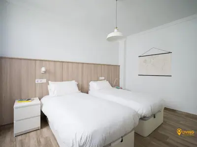 Cama o camas de una habitación en Living Las Canteras Homes- VIEW POINT