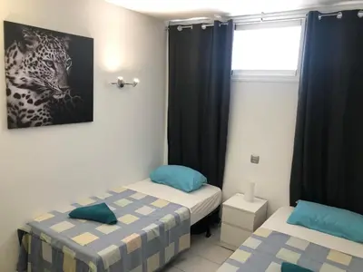 Cama o camas de una habitación en ALOE Suite Laurent-Gael