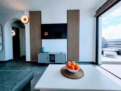 Una televisión o centro de entretenimiento en Cactus Apartment