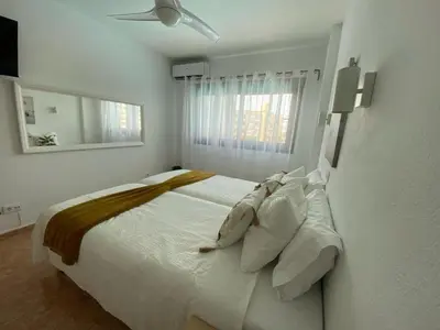 Cama o camas de una habitación en Iguazu dreams apartment