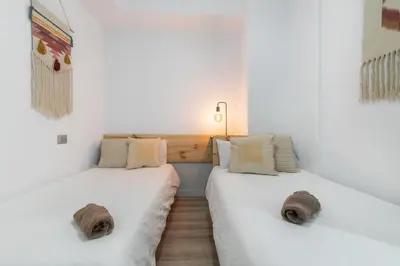 Cama o camas de una habitación en Home2Book Charming Design Apt Las Canteras Beach