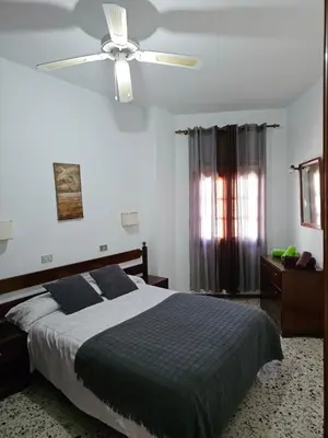 Cama o camas de una habitación en Apartamentos Viviendas vacacionales Isabel Maria