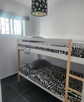 Cama o camas de una habitación en Bungalow del sol