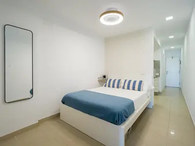 Cama o camas de una habitación en Apartamento Primera línea playa