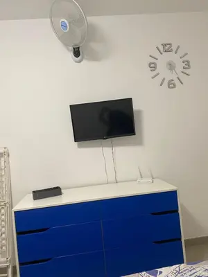 Una televisión o centro de entretenimiento en Canalex 1