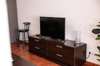 Una televisión o centro de entretenimiento en Deluxe Las Marinas Beach - by Gestión Vacacional Canarias