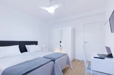 Cama o camas de una habitación en Las Palmas Smart Rooms