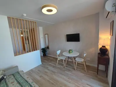 Una televisión o centro de entretenimiento en 3Min Walk Playa del Inglès Apartment