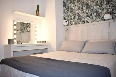 Cama o camas de una habitación en La Puntilla Deluxe Apartment