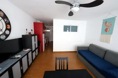 Una televisión o centro de entretenimiento en Confortevole appartamento playa del ingles
