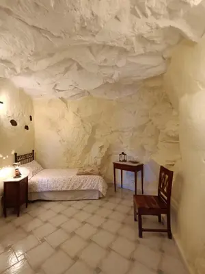Cama o camas de una habitación en Casa cueva El Balcón del Cortijo
