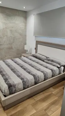 Cama o camas de una habitación en ALAMO LUXURY APARTMENT