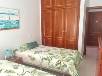 Cama o camas de una habitación en Casa playa Las Canteras