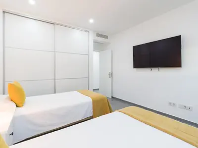 Una televisión o centro de entretenimiento en Salobre Golf Villas Tabaibas