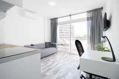 Una televisión o centro de entretenimiento en El 303, relax en Playa del Ingles