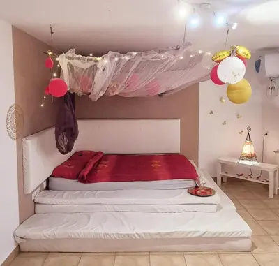 Cama o camas de una habitación en Flor de Loto Tantra Xtreme