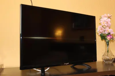 Una televisión o centro de entretenimiento en Hotel Olympia