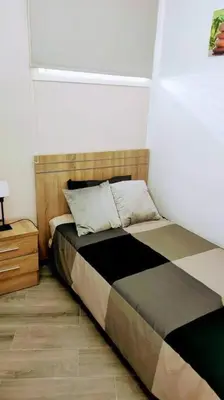 Cama o camas de una habitación en La Palmera 311 by CASAS COCODRILO