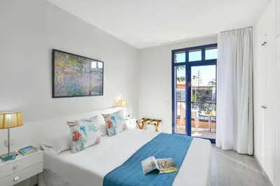 Cama o camas de una habitación en Meloneras Bahia 28 by VillaGranCanaria