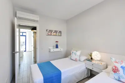 Cama o camas de una habitación en Meloneras Bahia 28 by VillaGranCanaria