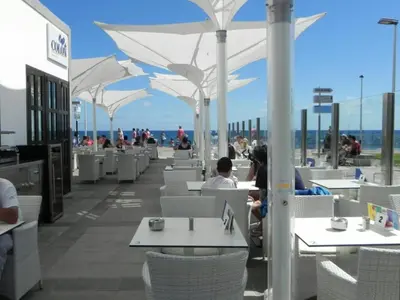 Un restaurante o sitio para comer en Meloneras Bahia 28 by VillaGranCanaria