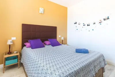 Cama o camas de una habitación en Casa Pizquito Agaete con piscina
