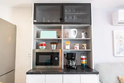 Una cocina o zona de cocina en OASIS PLAYA DEL INGLES 324 by Homestaygrancanaria