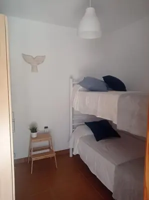 Cama o camas de una habitación en Casa en la playa, Aldea Coast
