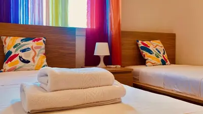 Cama o camas de una habitación en Casa de Las Flores
