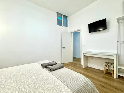 Una televisión o centro de entretenimiento en Apartamento Savaya Suite
