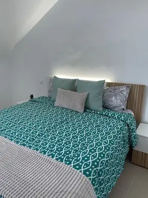 Cama o camas de una habitación en La Buhardilla