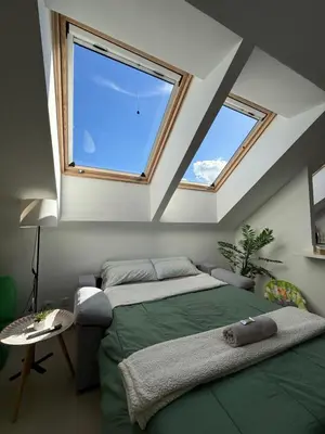 Cama o camas de una habitación en La Buhardilla