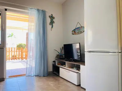 Una televisión o centro de entretenimiento en Meloneras Green Oasis Stress Less