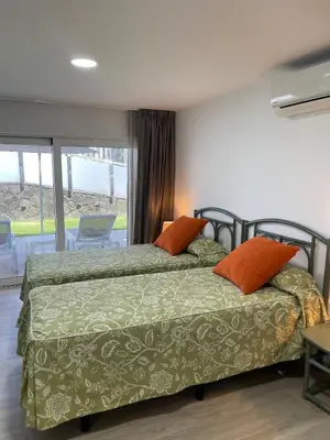 Cama o camas de una habitación en Oasis Playa Maspalomas