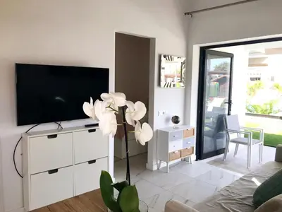 Una televisión o centro de entretenimiento en Maspalomas Relax
