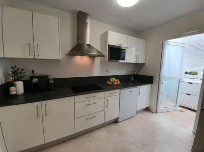 Una cocina o zona de cocina en Ocean Apartment Tauro, Fast WI-FI, Pool, Terrace