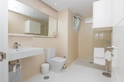 Un baño de Mimosas suites
