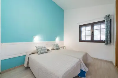 Cama o camas de una habitación en Cozi Bungalow in Maspalomas