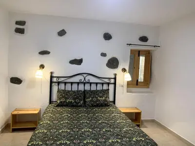 Cama o camas de una habitación en Casa (bajo), Tasarte.