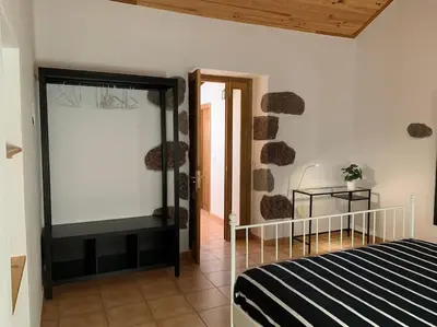 Cama o camas de una habitación en Tasarte. Casa adosada. Berajot 9.
