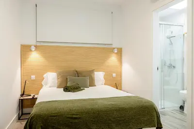 Cama o camas de una habitación en Bambú Suites Vegueta Alquiler por Habitación