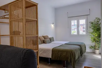 Cama o camas de una habitación en Bambú Suites Vegueta Alquiler por Habitación