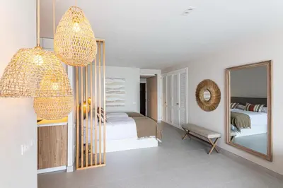 Cama o camas de una habitación en La Grand Suite las Canteras ll