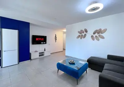 Una televisión o centro de entretenimiento en Apartamento con Terraza y Vistas