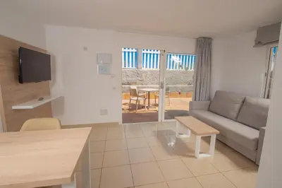 Zona de estar de Apartamentos Cocoteros